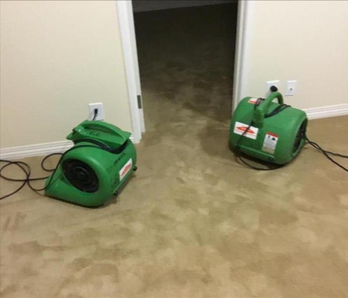 Air movers drying out a home in Layton, UT