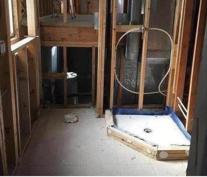 Image of a bathroom and shower with flood cuts 